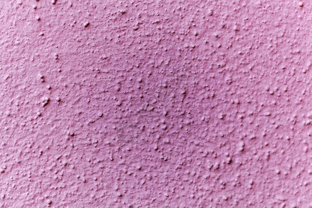 粉红色墙壁表面的微距照片图片