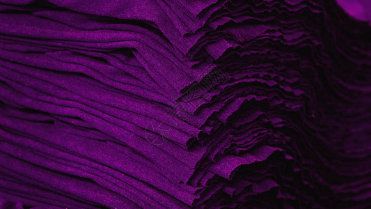 紫布服装质地材料纺织图案背景图片