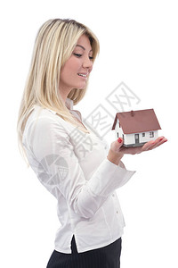 房屋和女商人的房地产中住房投资概念与图片