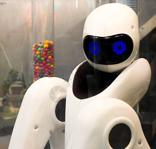 有眼睛和手臂的可爱机器人用手臂煮咖啡的机器人机器人咖啡机现代技术自图片