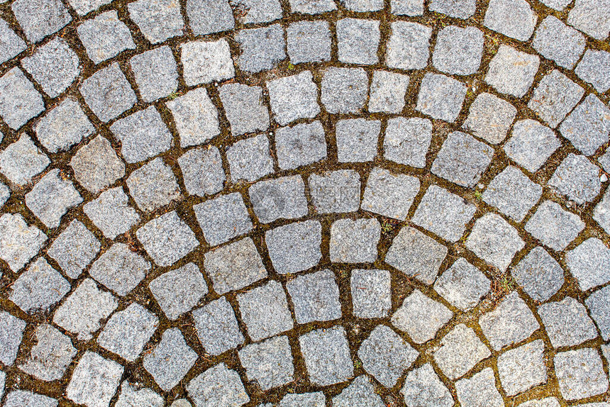 花岗岩石的铺面古老的cobblestone路面结构石块之间的抽象背图片