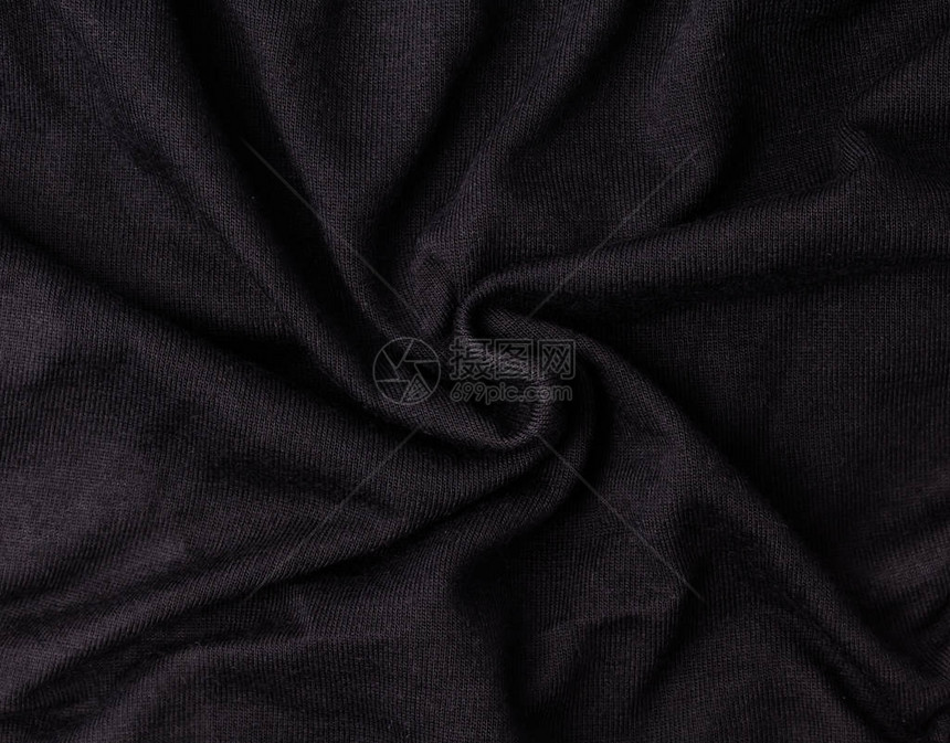 皱巴的黑色织物纹理背景图片