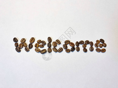 由烤咖啡豆制作的欢迎词背景图片