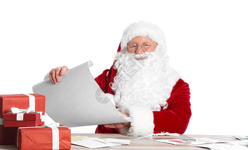 圣诞老人阅读白色背景的背景图片