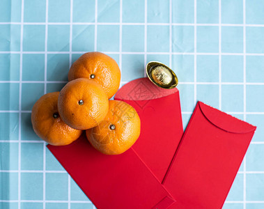 农历新年和农历新年假期概念背景的配饰白盘中的橙色图片