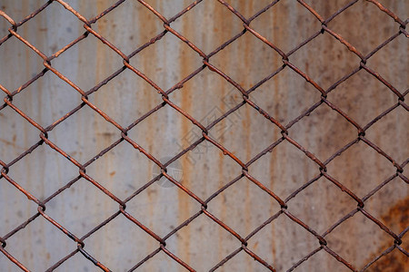 Rusty网格背景纹理股面照片集中在栅栏的一个背景图片