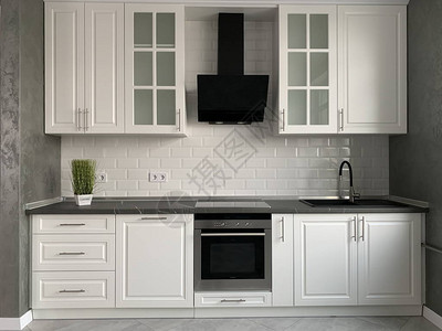 白色厨房家具搭配黑色台面新的现代厨房带罩和水槽室内设计厨房工作室图片