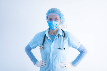 医生护士外科医生心理学家与保护面具眼镜和手套一起工作图片