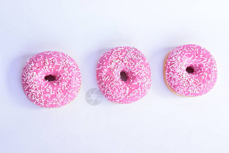 粉红色釉面甜圈特写背景图片
