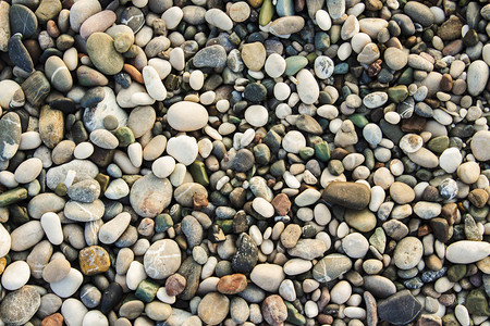 海滩石块小石头和沙子的质地图片