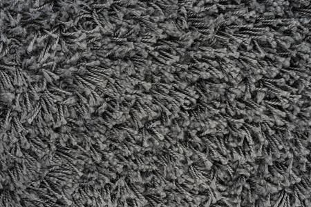 黑色天然毛绒地毯纹理背景深羊毛织布纹理背景图片