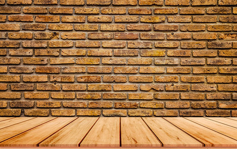 棕色砖墙背景和带木板的木地板图片
