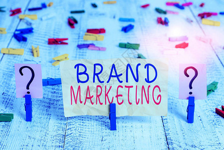 概念手写显示品牌营销概念意思是创建一个名称来识别和区分产品碎纸片背景图片