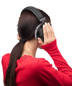 妇女用耳机监听音乐在白色图片