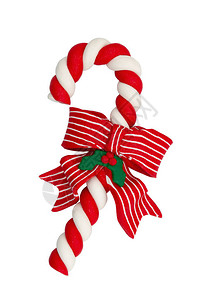 圣诞糖果可以红白相间蝴蝶结在白色上隔离背景图片