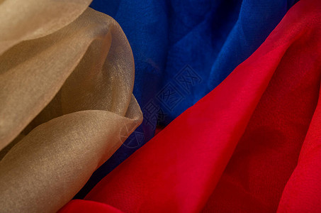 丝绸的金红色和蓝色织物造背景图片