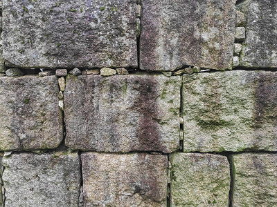 具有规则形状的矩形石块的石墙纹理背景图片