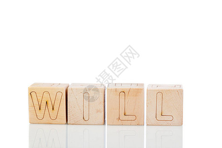 带字母的Wooden立方体将在白背景图片