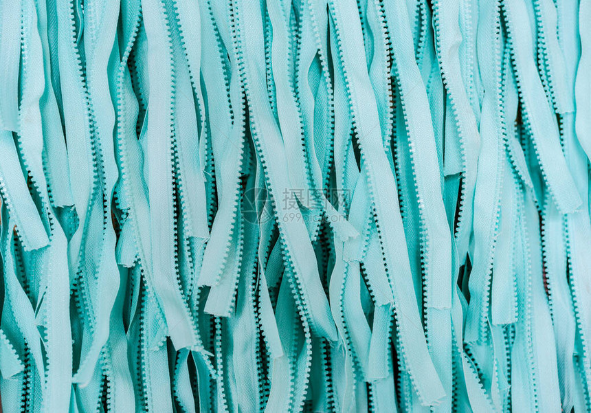 绿宝石蓝色结构纹理材料纺织拉链宏观模糊的抽象背景文字空间此处为光线图片