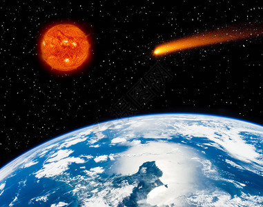 地球燃烧的太阳和飞行的彗星图片