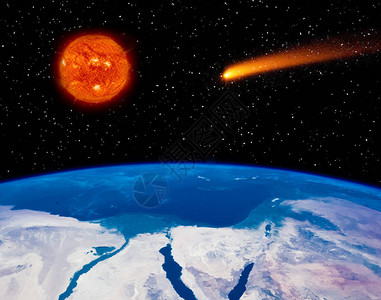地球燃烧的太阳和飞行的彗星图片