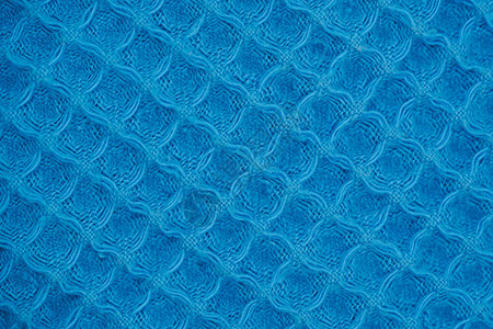 编织的羊毛纺织品材料背景的蓝色天然纹理图片