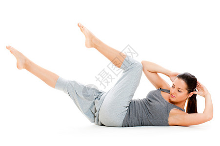 妇女为腹部肌肉做锻炼在whit图片