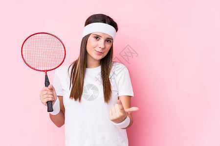 玩羽毛球的年轻caucasian女人图片