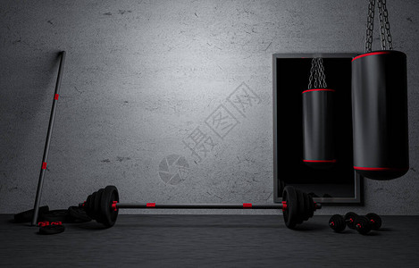 带哑铃和杠铃的沙袋在家里的健身房里涂成黑色灰色石膏和肮脏的旧墙在GymBarbell与地板上的重量板锻炼的健身器材背景图片
