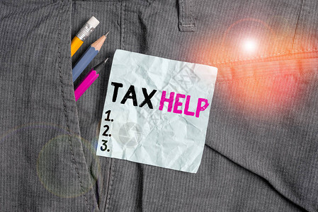 文字书写文本税务帮助商业照片展示了对税收的强制贡献的援助书写设备和男工裤口袋内背景图片
