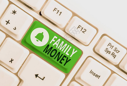 概念手写显示家庭金钱概念意味着已建立的上层家庭的继承财富白色pc键盘背景图片