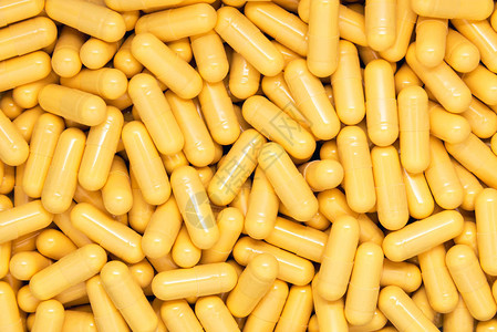黄色药物胶囊背景图片