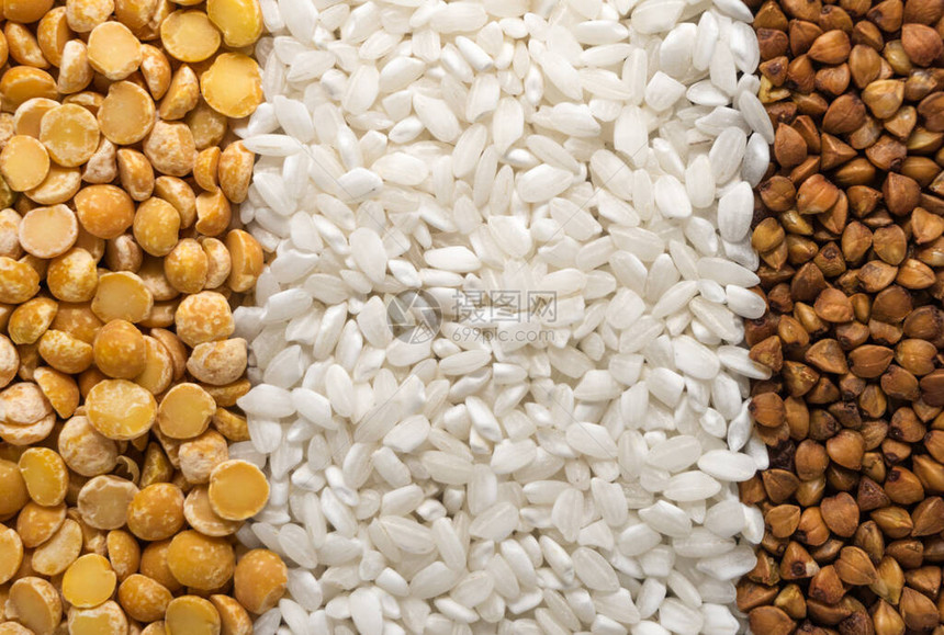 白大米和黄豆背景纹理分离的曲麦稻梨粒子图片