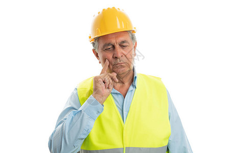 建筑工人用食指触摸额头图片