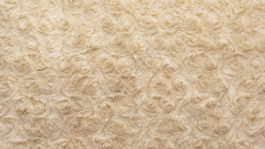 米色天然羊毛与曲折纹理背景图片