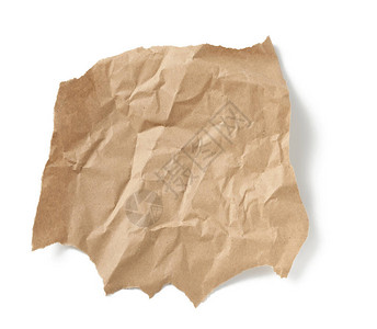 在白色背景上隔离的一块折成碎形棕色纸背景图片