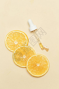 柠檬精油滴管吸和柠檬片图片