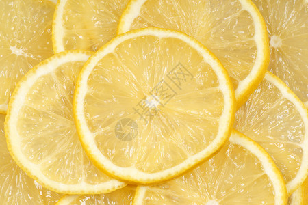 有机背景的新鲜柠檬片特写图片