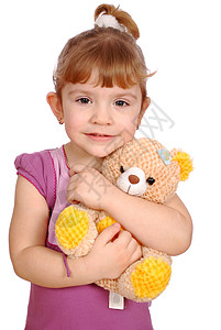带着泰迪熊玩具的小女孩图片