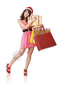 快乐的购物女孩拿着袋子和礼物盒图片