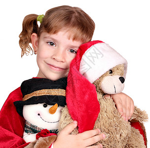 抱着玩具熊圣诞老人的小女孩图片
