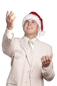 白色背景中戴圣诞老人帽子的英俊男子肖像图片