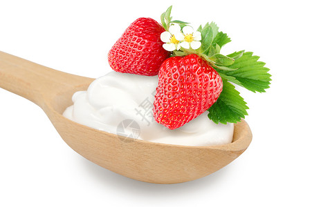 Wooden勺子有奶油和新鲜草莓图片