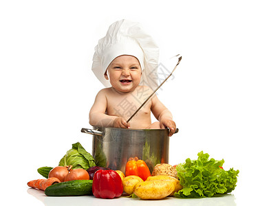 小男孩在厨师的帽子上与图片