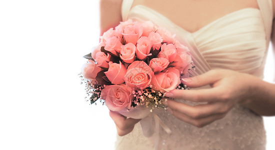 新娘手中的白色婚礼花束图片