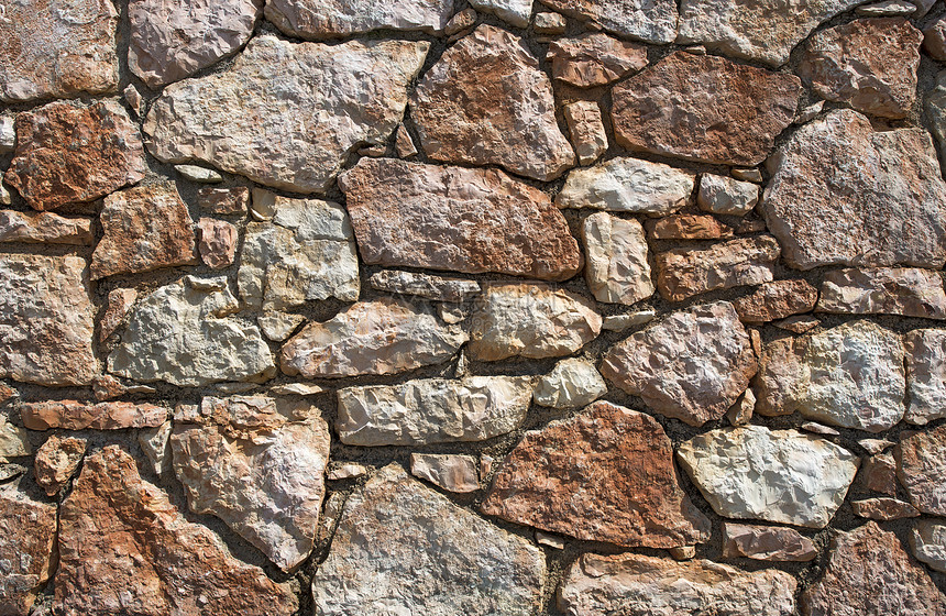 一堵古老的棕色石墙是绝佳的背景图片