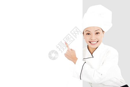 亚洲微笑的年轻女厨师图片