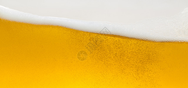 啤酒泡沫波金色啤酒杯玻璃泡沫王冠喷洒酒精蘑菇图片