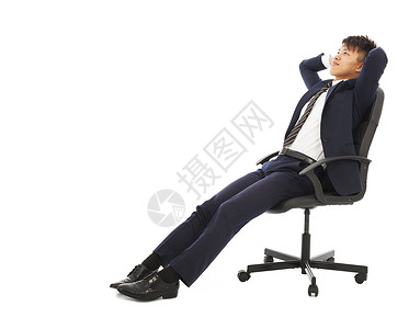 坐在椅子上抱着头的商人图片