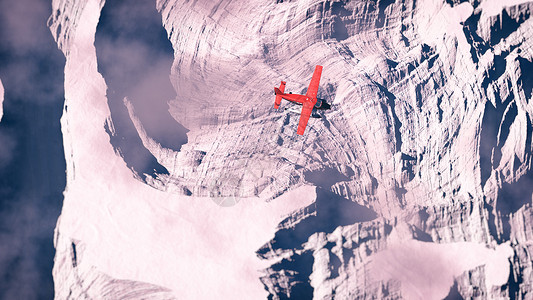 红色飞机在北极雪景上空飞行图片